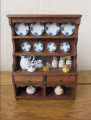 Filled cottage dresser