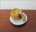 Meat pie with slice on plate