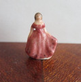 Lady figurine in salmon pink