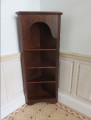 Dark wood corner shelves by The Toybox