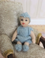  Baby  in hand knit outfit