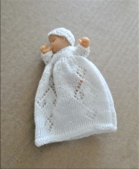 Baby in hand knit outfit