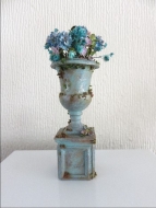  Blue flower filled aged urn