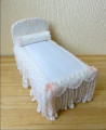   Lace covered single bed