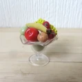 Stemmed glass dish with fruit