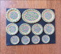 Set of 11 plates by V Fasken