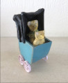 Toy pram with teddies