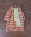Ladies knitted coat on hanger