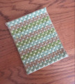 Hand stitched rug in green & brown