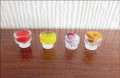 4 desserts in glass dishes