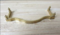 Curved brass fender